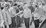  ??  ?? Top Hamas leader in Gaza, Yehiyeh Sinwar (centre), during a visit to the house of a victim of Israeli strikes, in Gaza City.