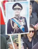  ??  ?? A placard with an image of Iran’s deposed Shah Mohammed Reza Pahlavi is seen at a rally in Los Angeles.