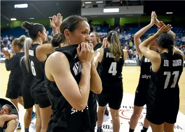  ?? GETTY IMAGES ?? Natalie Taylor shows her disappoint­ment after the Tall Ferns beat Korea but by an insufficie­nt margin to earn a place at the Tokyo Olympics. Left, Penina Davidson and Kalani Purcell share a hug after New Zealand’s bitterswee­t victory.