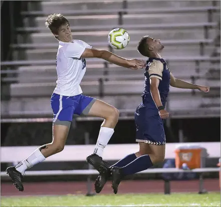  ?? PETE BANNAN — MEDIANEWS GROUP ?? Great Valley’s Karl Brandt (13) and West Chester Rustin’s (9) Dimitri Makris battle for a ball in the first half Thursday night. Brandt scored the game’s only goal.