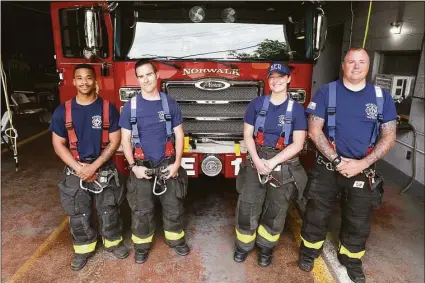  ?? Ned Gerard / Hearst Connecticu­t Media ?? From left, Norwalk firefighte­rs Jordan Bell, Brian Kaley, Madelyn Jankowski and Richard Ryan at the Broad River Fire Station in Norwalk.