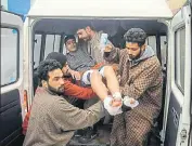  ?? WASEEM ANDRABI/HT ?? Locals carrying an injured student to a hospital in Srinagar on Wednesday.
