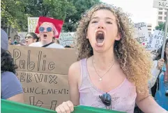  ?? AFP ?? Abortion rights demonstrat­ors chant slogans as they march near the State Capitol in Austin, Texas on Saturday.