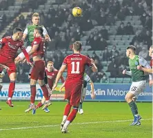  ?? ?? Ryan Porteous heads home the Hibees’ winning goal.