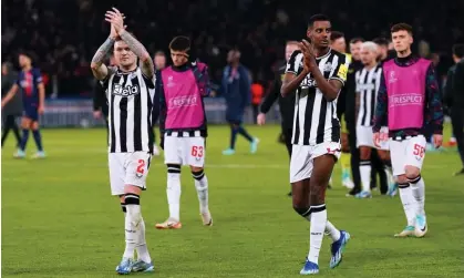  ?? Photograph: Owen Humphreys/PA ?? Newcastle United’s Kieran Trippier and Alexander Isak applaud the fans at the end of their Champions League match against Paris SaintGerma­in.