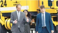  ?? JOHN SMIERCIAK/POST TRIBUNE ?? Daniel F. Vicari, from left, executive director of the Gary/Chicago Internatio­nal Airport walks with Joy Holliday, chief of staff for the city of Gary, and Congressma­n Frank J. Mrvan after a ceremony that commemorat­ed $6 million in federal funds to support air cargo infrastruc­ture at the Gary/Chicago Internatio­nal Airport, in Gary on Wednesday.