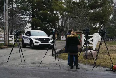 ?? The Associated Press ?? ■ Police secure the entrance to the neighborho­od of former Vice President Mike Pence’s home on Friday in Carmel, Ind.