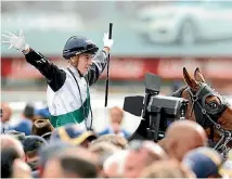  ?? GETTY IMAGES ?? Cory Parish celebrates Boom Time’s victory in the Caulfield Cup.