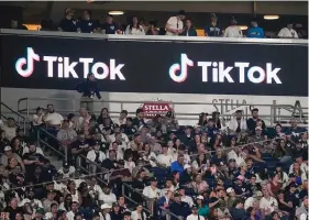  ?? (AP Photo/Frank Franklin II/File) ?? Fans sit under a TikTok ad at a baseball game at Yankee Stadium on April 14, 2023, in New York. A bill that could lead to the popular video-sharing app TikTok being unavailabl­e in the United States is quickly gaining traction in the House. Lawmakers advanced legislatio­n against TikTok Thursday as they voiced concerns about the potential for the platform to surveil and manipulate Americans.