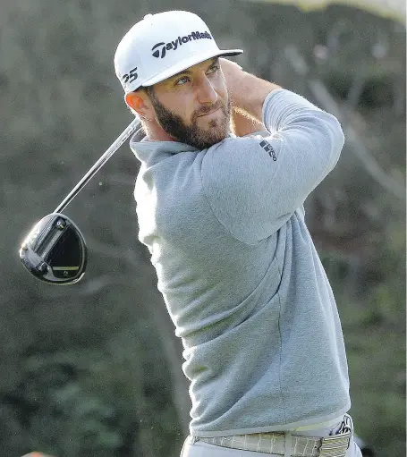  ?? ROBERT LABERGE / GETTY IMAGES ?? American Dustin Johnson makes driving a golf ball look so effortless, but gets incredible results for distance.