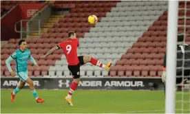  ?? Photograph: Tom Jenkins/NMC Pool/The Guardian ?? Danny Ings loops the ball over Alisson to give Southampto­n an early lead.