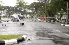  ??  ?? Canopies set up near the parking lot in front of SK Jalan Bintang were blown away by the strong wind.