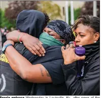  ?? (Xavier Burrell/The New York Times) ?? People embrace Wednesday in Louisville, Ky., after news of the grand jury’s decision to indict one former Louisville police officer on charges not directly related to the shooting death of Breonna Taylor in March. More photos at arkansason­line.com/924taylor/.