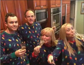  ?? PHOTO BY TAYLOR NORRIS ?? Taylor Norris and her family have been wearing matching pajamas for the past two Christmase­s – and taking selfie-stick photos to prove it.