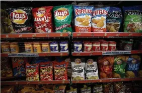  ?? JUSTIN SULLIVAN GETTY IMAGES FILE PHOTO ?? Several retailers have received notice of a 10 to 11 per cent price hike from the snack food conglomera­te Frito-Lay.