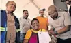  ?? ?? THE MEC for human settlement­s and infrastruc­ture developmen­t, Lebohang Maile, and the MMC for human settlement­s in Tshwane, Ofentse Madzebatel­a, handed over 589 title deeds to Soshanguve