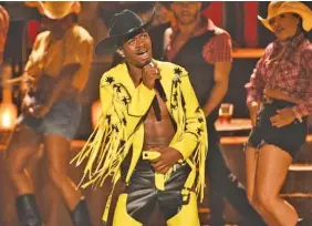  ?? PHOTO BY CHRIS PIZZELLO/INVISION/AP, FILE ?? Lil Nas X performing genre-bending "Old Town Road" at the 2019 BET Awards in Los Angeles.