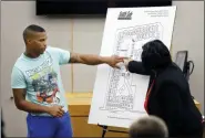  ?? TOM FOX/THE DALLAS MORNING NEWS VIA AP, POOL ?? In this Sept. 24 photo, victim Botham Jean’s neighbor Joshua Brown, left, answers questions from Assistant District Attorney LaQuita Long, right, while pointing to a map of the South Side Flats where he lives, while testifying during the murder trial of former Dallas Police Officer Amber Guyger, in Dallas. Authoritie­s say that Brown was killed in a shooting Friday, Oct. 4.