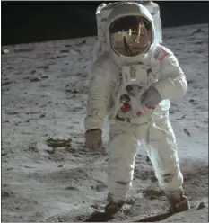  ?? ASSOCIATED PRESS ?? In this July 20, 1969 photo made available by NASA, astronaut Buzz Aldrin, lunar module pilot, walks on the surface of the moon near the leg of the Lunar Module “Eagle” during the Apollo 11 extravehic­ular activity.