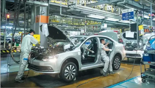  ?? PROVIDED TO CHINA DAILY ?? Workers check a car at FAW-Volkswagen’s production line in Chengdu, Sichuan province.