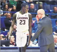  ?? Stephen Dunn / Associated Press ?? UConn’s Akok Akok has remained positive through rehab after tearing his left Achilles in February.