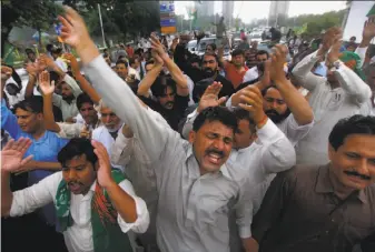  ?? Anjum Naveed / Associated Press ?? Supporters of Pakistan’s deposed Prime Minister Nawaz Sharif rally in Islamabad to condemn his dismissal. The Supreme Court removed him from office for concealing assets.