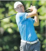  ?? JOHN WOIKE, HARTFORD COURANT ?? Jordan Spieth fired a 1-under 69 at the Travelers Championsh­ip on Friday to stay in the lead.