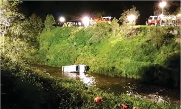  ?? Photograph: ABC News, Lloyd Young. ?? Heavy haulage was required to extract the utility from the water after it plunged down a seven metre embankment on Evans Rd, Bunyip on Friday night.