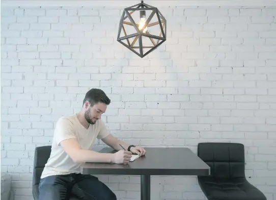  ?? PHOTOS: PIERRE OBENDRAUF ?? Jason Boivin enjoys his small dinning area in front of an exposed brick wall in his 760-square-foot condo in Plateau Mont-Royal.