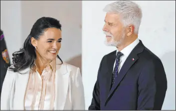  ?? Petr David Josek The Associated Press ?? Czech Republic President Petr Pavel, right, welcomes Hungarian President Katalin Novak on Wednesday for the V4 Summit in Prague, Czech Republic.