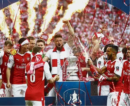  ??  ?? Consolatio­n prize: A surprise FA Cup win over English Premier League champions Chelsea last month briefly lifted Arsenal supporters’ spirits. — AP