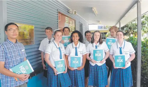  ??  ?? PUT TO TEST: St Andrew's Catholic College Chinese teacher Shixiang Chen with students Joseph Merchant, Madelaine Pinchbeck, Brennan Belcher, Leilani Tela, Ciaran Gruber, Viaan Thompson, Toby Wallis and Ella Blandford.