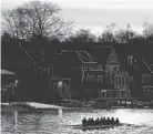  ?? MATT ROURKE/AP ?? A crew sets out on the Schuylkill River on Thursday as lights illuminate the outline of structures on the famous Boathouse Row in Philadelph­ia.