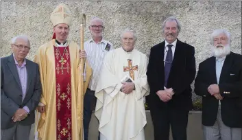  ??  ?? Fr. Nolan with Bishop Denis Brennan and former schoolmate­s (from left) Seamus Ryan, Andreas Minihan, Brian Mathews and Danny Brennan.