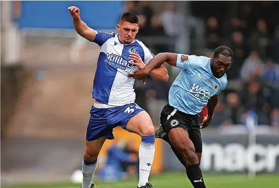  ?? ?? Bristol Rovers defender Bobby Thomas battles for the ball against Boreham Wood yesterday