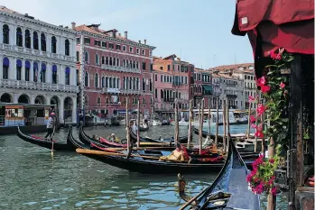  ??  ?? A timeless scene of gondolas and waterfront palazzi unfolds along the Grand Canal in Venice, whose famous waterways are both famous and enchanting.