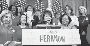  ?? J. SCOTT APPLEWHITE/ AP ?? Rep. Jackie Speier, D- Calif., holds up a copy of the Constituti­on during an event about removing the deadline for ratification of the ERA.