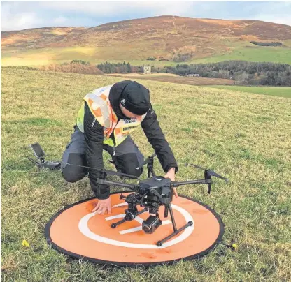  ??  ?? Members of mountain rescue teams in Scotland are being trained in the use of drones for aerial photograph­y.