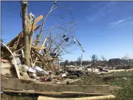  ?? TRAVIS LOLLER — THE ASSOCIATED PRESS ?? A subdivisio­n near McBroom Chapel Road in Putnam County, Tennessee, was almost completely destroyed by a tornado that blew through on Tuesday morning, March 3, 2020before dawn. On Wednesday, volunteers cut damaged tress and sorted debris.