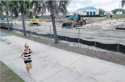  ?? KEVIN SPEAR/ORLANDO SENTINEL ?? Orlando Utilities Commission is preparing to build a substation near Lake HIghland, the Urban Trail and SunRail tracks.