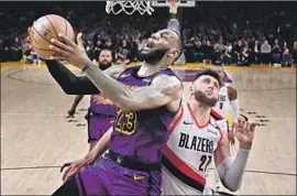  ?? Mark J. Terrill Associated Press ?? LeBRON JAMES HAD his best game as a Laker on Wednesday in a 44-point effort against the Portland Trail Blazers and center Jusuf Nurkic.