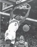  ?? NICK TURCHIARO/USA TODAY SPORTS ?? Raptors forward OG Anunoby dunks past 76ers forward Tobias Harris on Saturday.