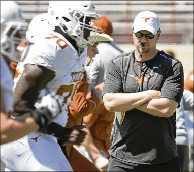  ?? JAY JANNER / AMERICAN-STATESMAN ?? Coach Tom Herman, a week away from his first preseason practice at UT, spoke to high school coaches Monday in Houston. “Hopefully I can make a small, tiny difference in helping them become better coaches,” he said.