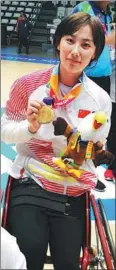  ?? PROVIDED TO CHINA DAILY ?? Dai takes a photo with a gold medal after winning at the 2018 Asia Para Games in Jakarta, Indonesia.