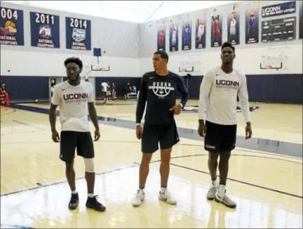  ?? PAT EATON-ROBB — THE ASSOCIATED PRESS ?? From left, UConn players Antwoine Anderson, Kwintin Williams and David Onuorah prepare to meet the media on Thursday in Storrs.