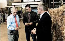  ?? BRUCE SCHREINER/AP ?? Sen. Mitch McConnell, left, inspects hemp taken from a bale at a processing plant.