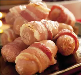  ?? HUW JONES ?? Pigs in blankets could be missing from Christmas dinner plates due to food shortages caused by coronaviru­s and Brexit