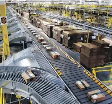  ??  ?? Amazon defends conditions in its warehouses and distributi­on centres, saying that the safety and welfare of employees is a top priority.