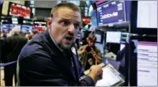  ?? RICHARD DREW — THE ASSOCIATED PRESS ?? Trader Michael Milano works on the floor of the New York Stock Exchange, Wednesday. Stocks are extending their slump on Wall Street, led by drops in big technology companies, as rising bond yields draw investors out of stocks.