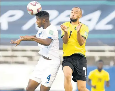  ?? RICARDO MAKYN ?? Kemar Roofe (right) in action for Jamaica against Panama’s Fidel Escobar Mendieta during their Concacaf World Cup qualificat­ion match at the National Stadium on Sunday, September 5.